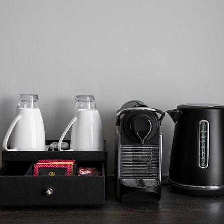 Oakwood Premier Melbourne Aparthotel Bagian luar foto A Nespresso coffee machine in a hotel room