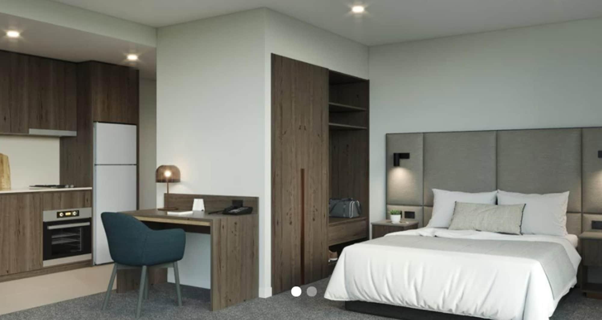 Oakwood Premier Melbourne Aparthotel Bagian luar foto A typical bedroom at the hotel