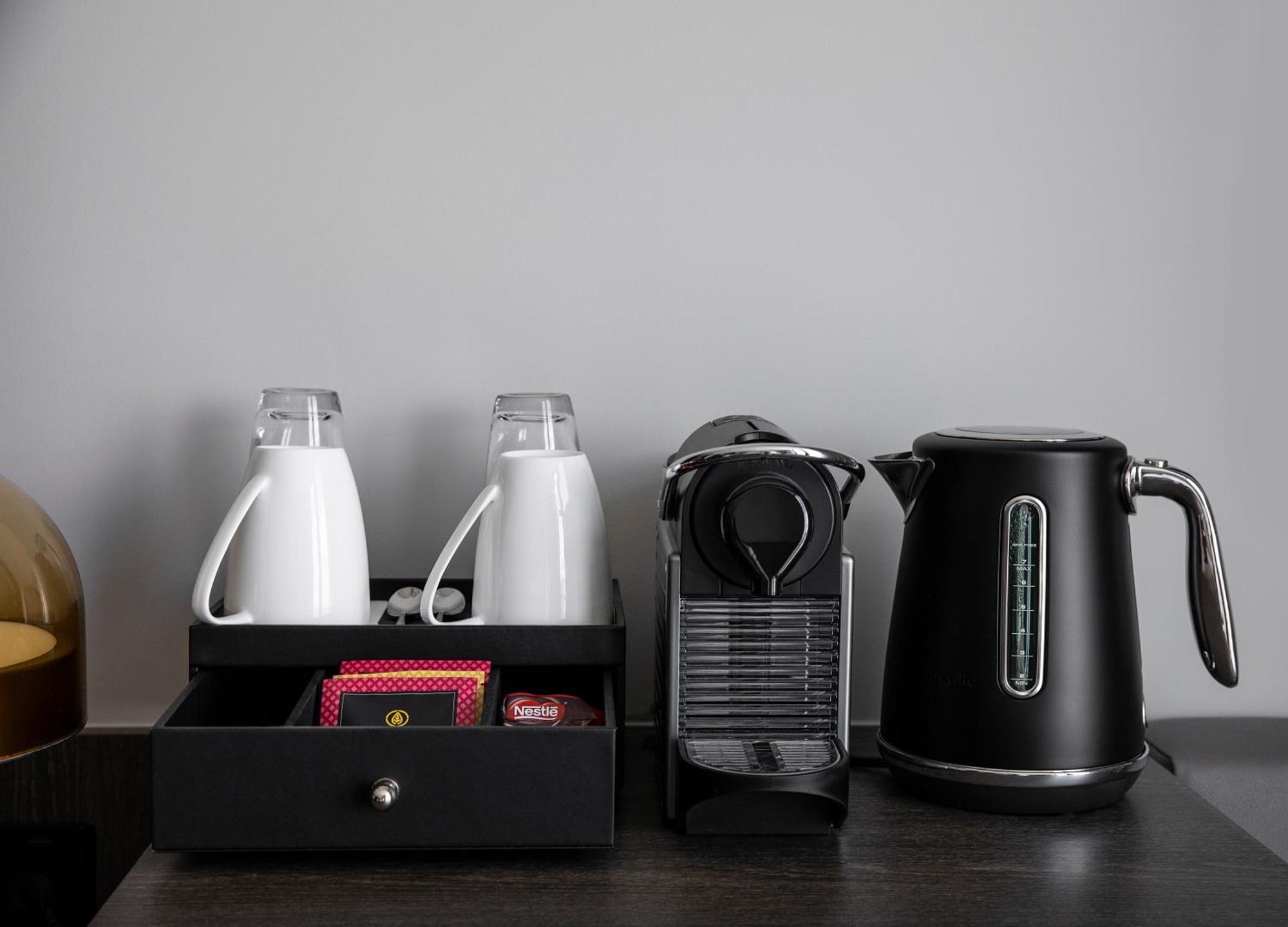 Oakwood Premier Melbourne Aparthotel Bagian luar foto A Nespresso coffee machine in a hotel room